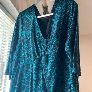 Striking emerald and black blouse